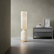 Designer ribbed floor lamp placed in contemporary interior