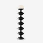 Modern stacked geometric floor lamp on white background