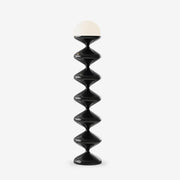 Modern stacked geometric floor lamp on white background
