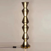 Luxury statement floor lamp placed in minimalist interior setting