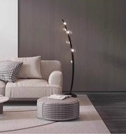 Contemporary floor standing lamp with glowing glass orbs in modern home décor