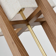 Close-up of textured fabric lampshade with wooden frame details