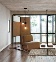 Designer wall light with two frosted glass globes in contemporary living space