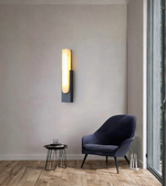 Modern marble wall light mounted in a minimalist living room