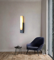 Modern marble wall light mounted in a minimalist living room