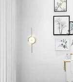 Designer round wall light with vertical rod in minimalist living room