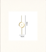 Sculptural disc wall lamp emitting soft warm ambient glow with dimensions