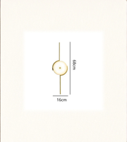 Sculptural disc wall lamp emitting soft warm ambient glow with dimensions