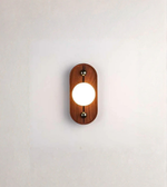 Contemporary wall light with warm ambient glow and wood finish