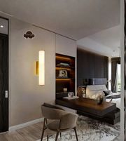 Modern interior design of a living room with a wall sconce and a chair.