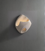 Modern wall light fixture on a gray wall