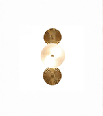 Two gold wall sconces on a white background