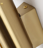 Close-up of a beige wallet with a gold button on a white background