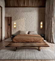 Minimalist bedroom featuring dual globe stone wall lights