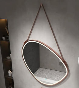 Modern bathroom vanity featuring illuminated hanging mirror
