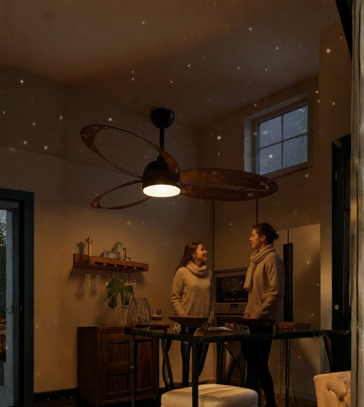 Two people standing in a dimly lit room with a ceiling fan and light fixture.
