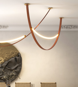 Modern ceiling light fixture with warm glow in a room setting