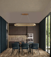 Modern kitchen with pendant light fixture, dining table, and chairs.