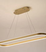 Gold pendant light fixture on a beige ceiling