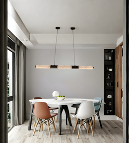 Modern dining area with a white table and colorful chairs against a gray wall.