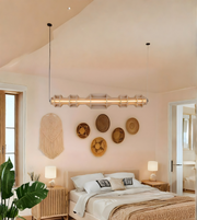 Modern bedroom with decorative wall art and a large bed.