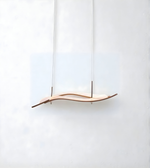 Wooden pendant light with a wavy design on a white background