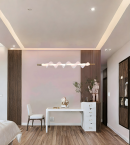Modern bedroom with a desk, chair, and decorative elements.