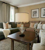 Living room with a couch, lamp, and decorative pillows.