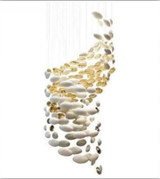 Decorative hanging light fixture with white and gold elements on a white background