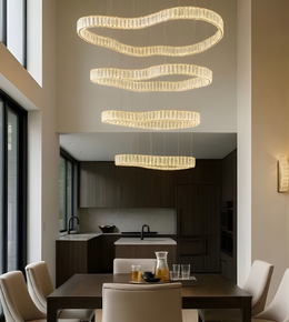 Modern kitchen with a stylish chandelier and dining table.