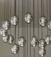 Chandelier with multiple spherical lights on a neutral background
