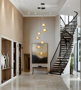 Modern staircase in a stylish interior with pendant lights and artwork.