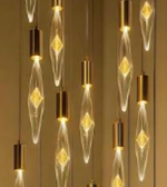 Decorative light bulbs with gold bases on a neutral background