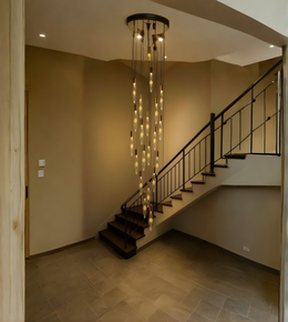 Staircase with decorative ceiling light fixture in a home interior.