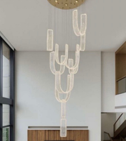 Modern chandelier hanging from a ceiling in a home interior.