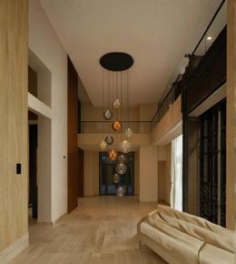 Modern interior with a stylish chandelier hanging in a hallway.