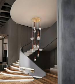 Modern staircase with a stylish chandelier in a home interior.