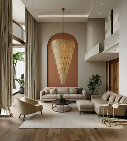Modern living room with a large chandelier, beige sofa, and armchair.