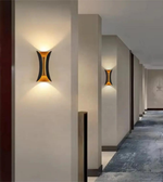 Modern wall sconces on a hallway wall