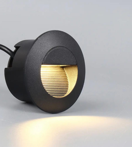 Black outdoor light fixture on a gray background