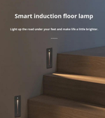 Smart induction floor lamp installed on a staircase with text indicating its function.