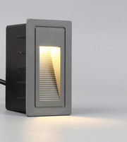 Rectangular outdoor light fixture on a gray background