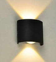 Black wall-mounted light fixture on a gray wall