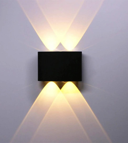 Modern wall-mounted light fixture on a plain wall