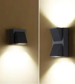 Two wall-mounted lights on a beige wall, one on the left and one on the right.