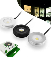 Three circular light fixtures with a smartphone displaying a building at night.