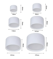 Set of white cylindrical objects with dimensions labeled on a white background