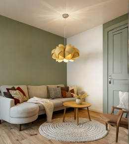 Modern living room with a beige sectional sofa, wooden coffee table, and decorative pillows.