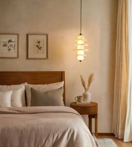 Cozy bedroom with wooden bed, side table, and decorative elements.