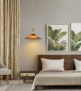 Modern bedroom with a bed, lamp, and wall art